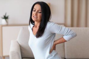 Woman in pain from kidney issues
