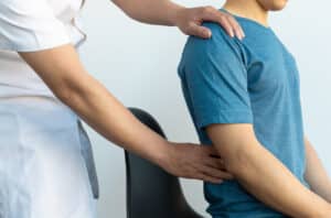 doctor diagnosing patient with kidney pain