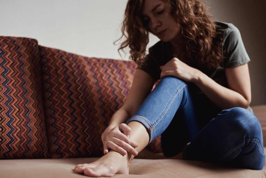 woman looking at kidney disease swelling in ankles