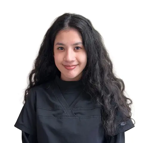 headshot of dark haired women in scrubs