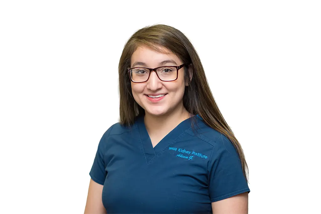 employee posing for headshot in scrubs