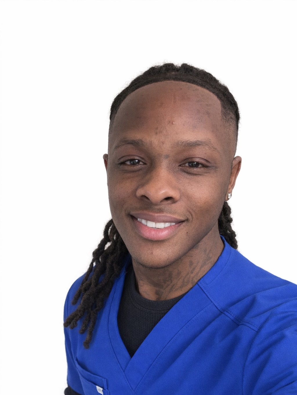 man posing for headshot in bright blue scrubs